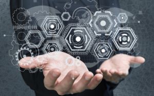 Man holding business elements icons on screen